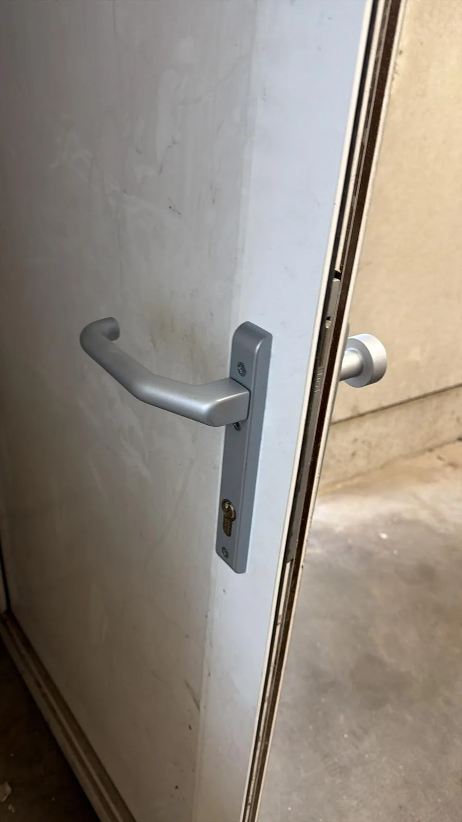 Professional locksmith replacing home lock securely in Sutton